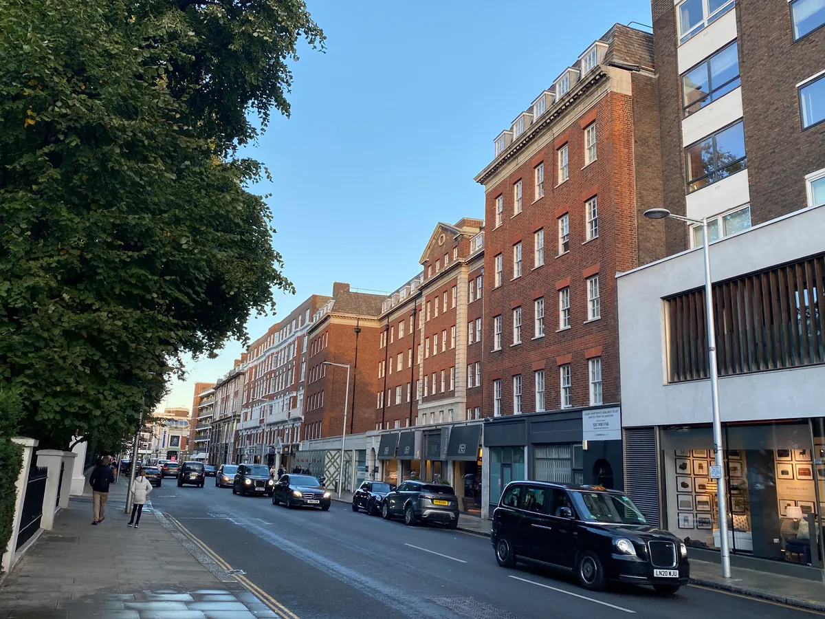 Shops and traffic on Fulham Road in Chelsea, the street linking the hotels near Stamford Bridge to the stadium