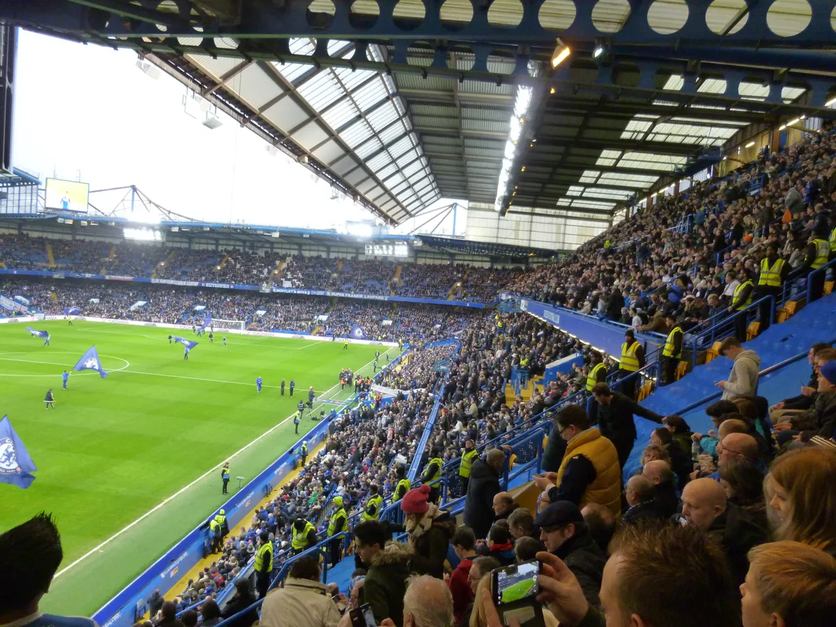 Full stand and pitch during a match at Stamford Bridge, the ground you walk on a Chelsea stadium tour