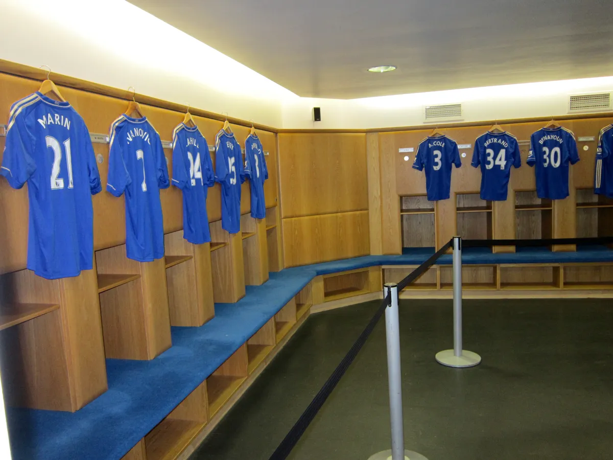 Home dressing room with player shirts hung around the walls on a Chelsea stadium tour at Stamford Bridge in London